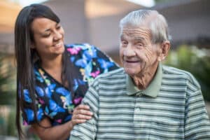 Nurse smiling with a senior resident